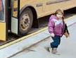Child getting off of bus