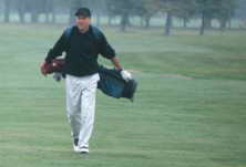 golfer walks the golf course green in Myrtle Beach